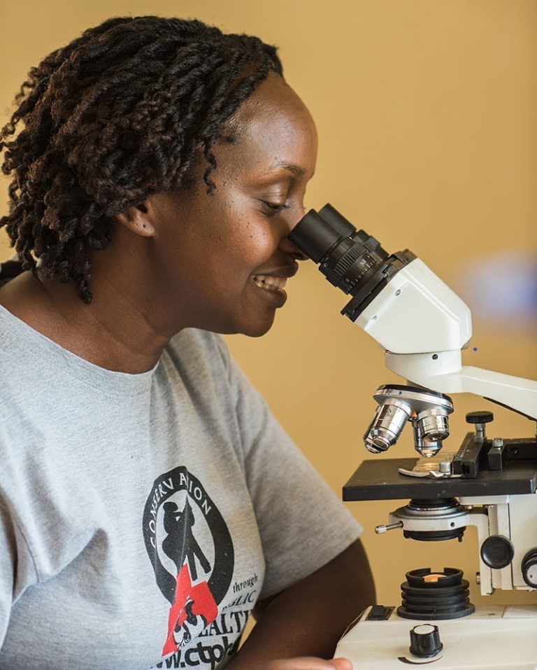 selective focus of ophthalmologist examining kid eyes with trial frame in clinic