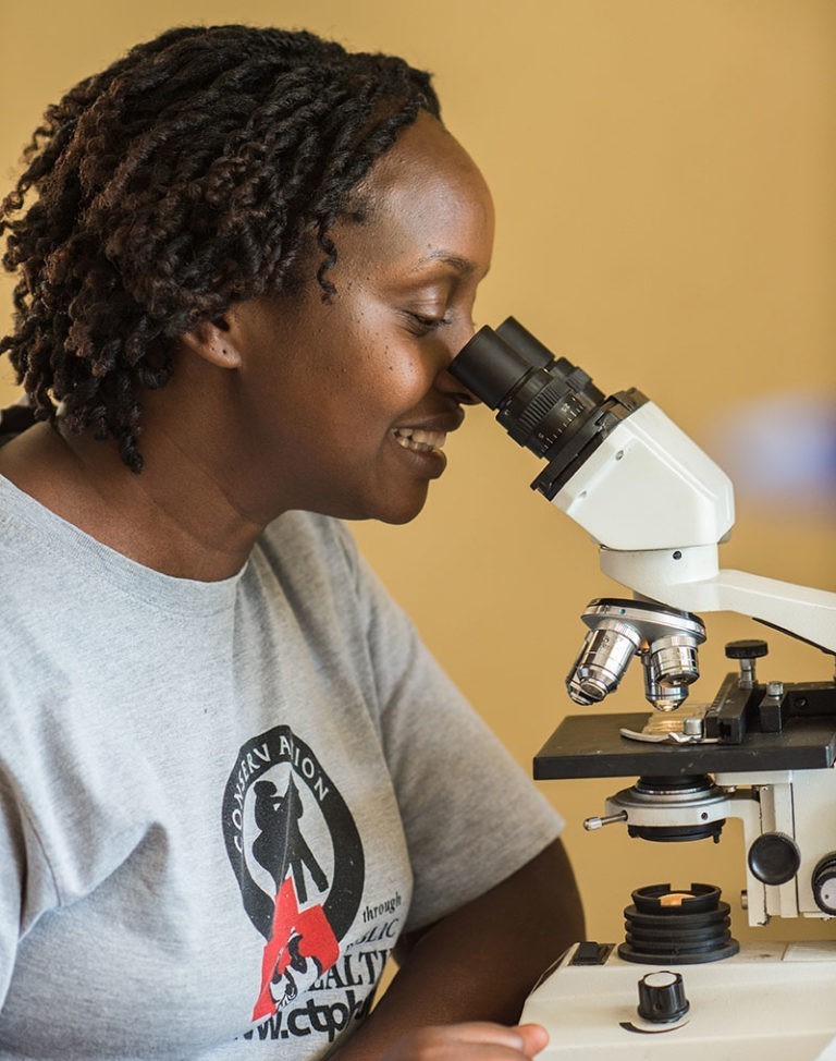 selective focus of ophthalmologist examining kid eyes with trial frame in clinic
